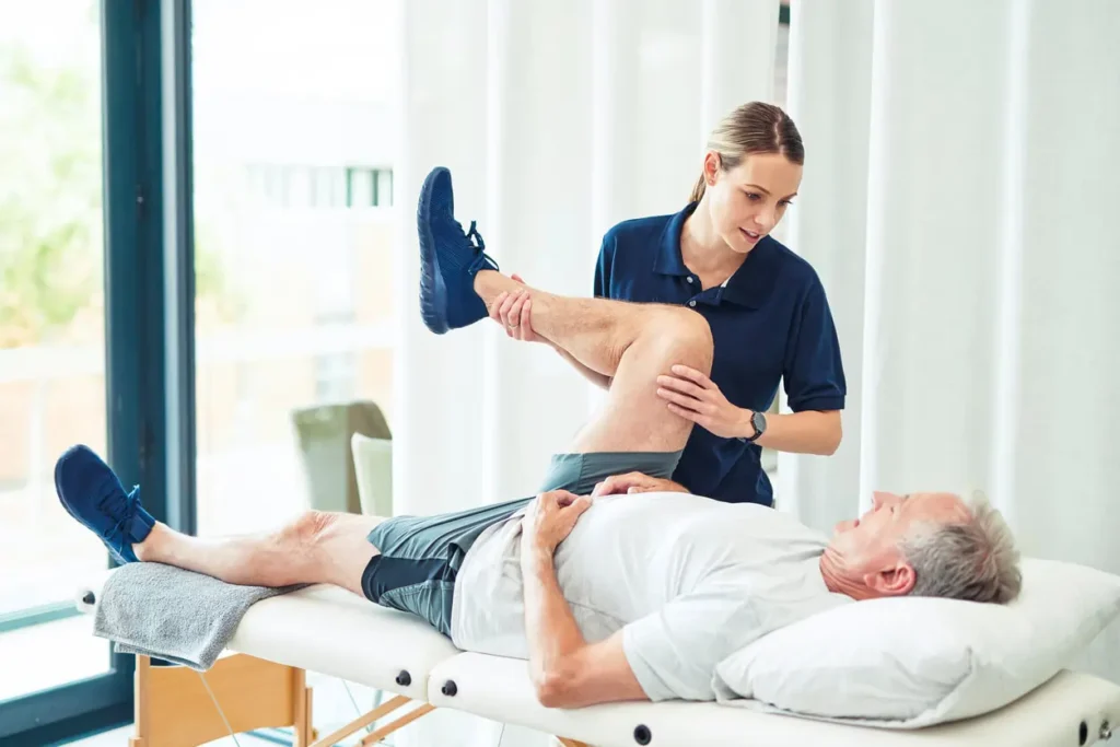 Revitalising Recovery: Effective Rehabilitation Strategies for Muscle Injuries 3 Physiotherapist assisting a patient with muscle recovery exercises Rushden