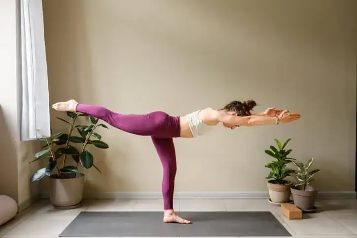 Achieving the Perfect Tone: How Often Should You Exercise for Results? 1 Woman doing Yoga exercise Rushden to help with toning the body.